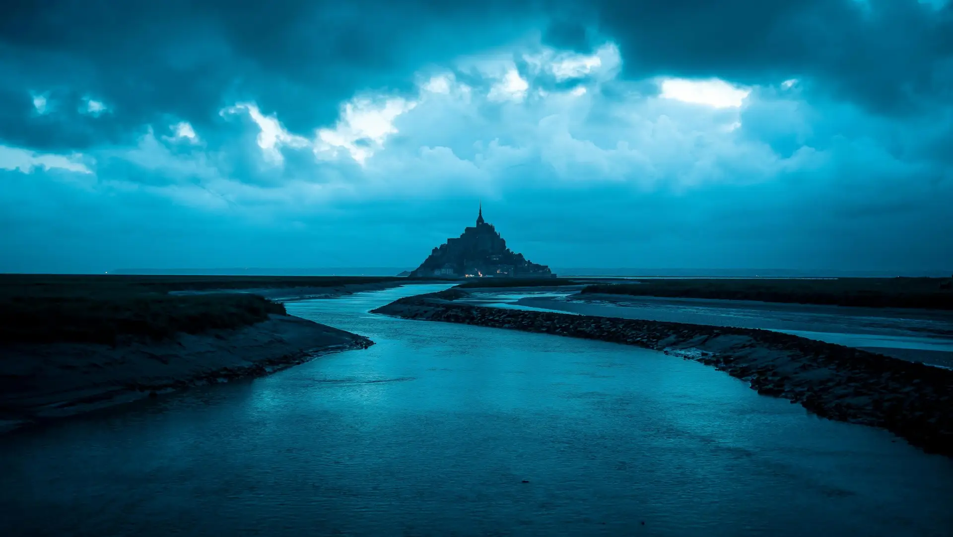 waterway leading to castle on the hill. Cropped to just show the river, representing the fluid nature of the portfolio