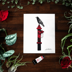 8x10 art print of a crow sitting on a hydrate, the print is surrounded by Green plants as a flay lay frame and mixed into the plants are two red roses and a tube of red paint.